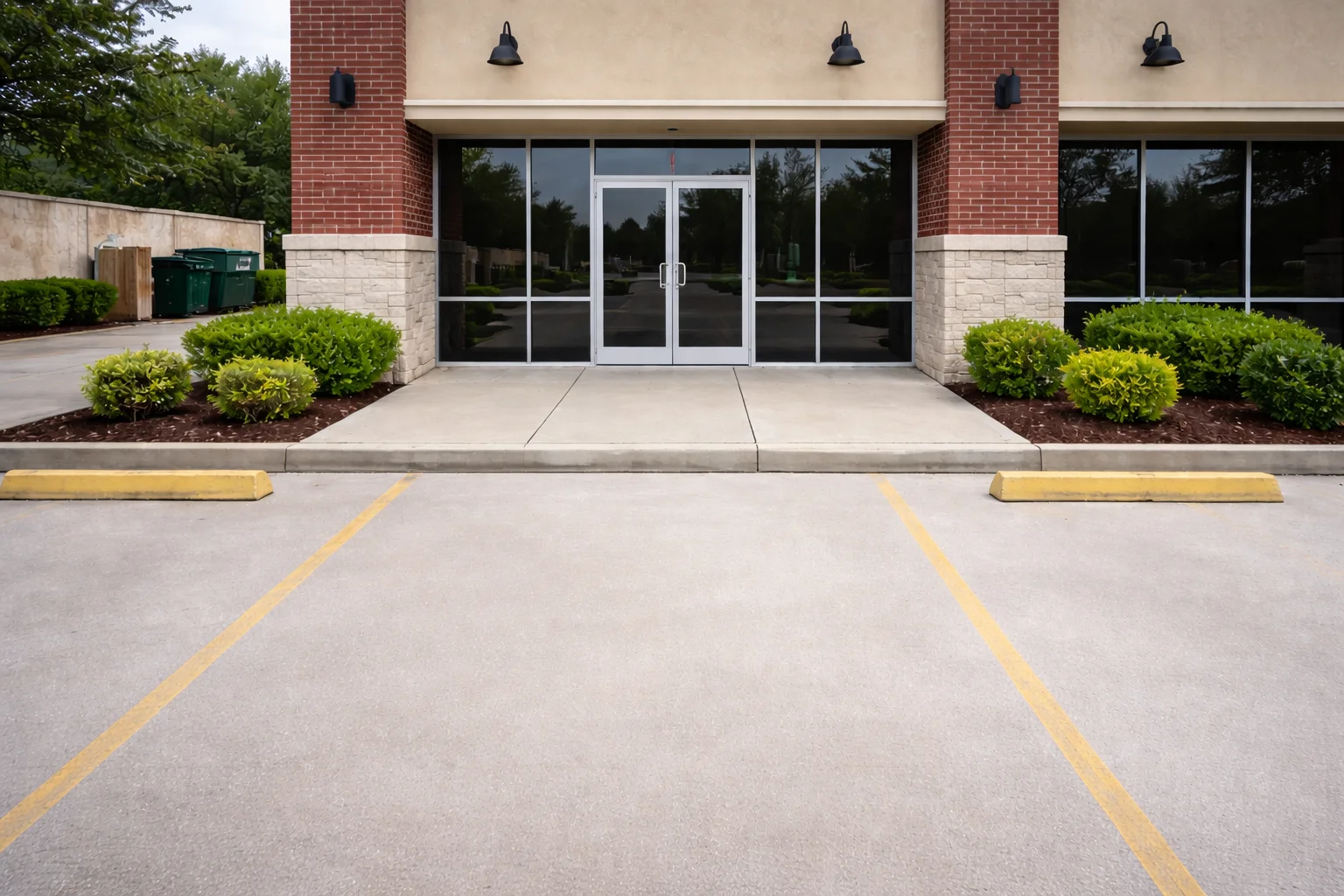 Clean commercial storefront and parking lot in Cypress, TX after professional pressure washing removed oil stains and algae